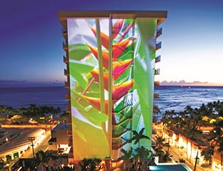 Light Monument projection on Beachside Tower at night