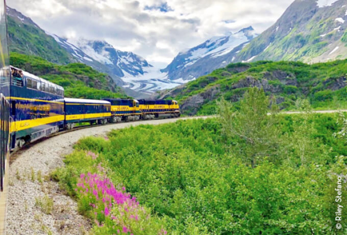 Photo of train with mountains