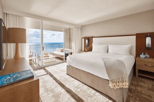 Rotating images of oceanfront suite, longboard club exterior and interior