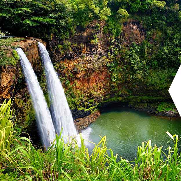 Image of waterfall and lush green landscape in Hawaii