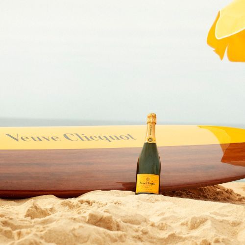 Bottle of Veuve Champagne with two champagne glasses