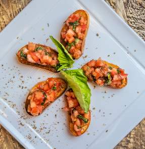 a plate of food on a wood surface